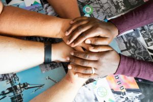 Jacqueline Vanderpuye holding couples hands